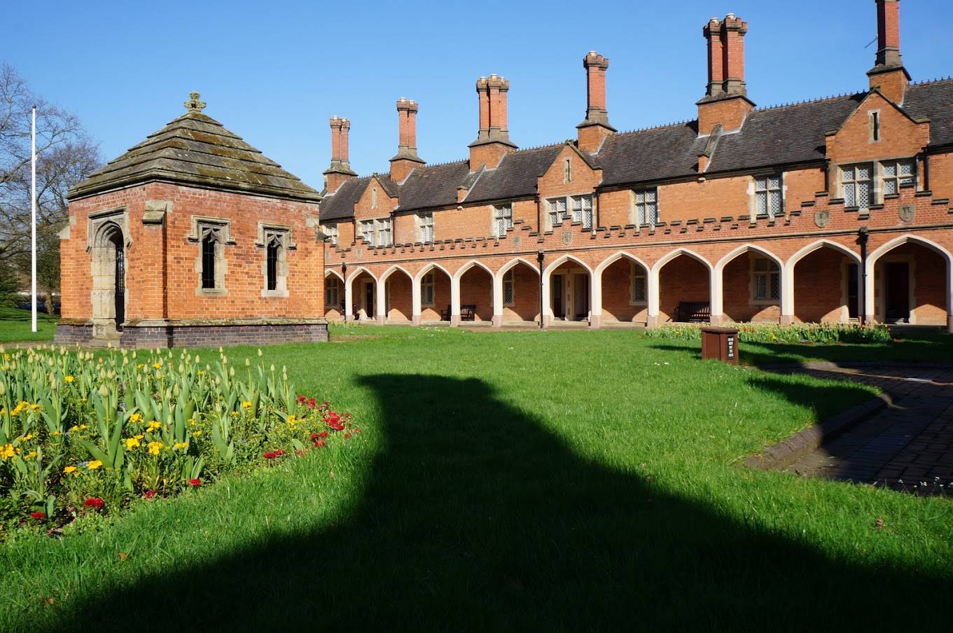 Old almshouses buildings with clear blue sky