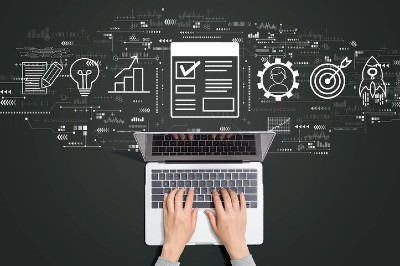 Man typing on computer with algorithms in background.