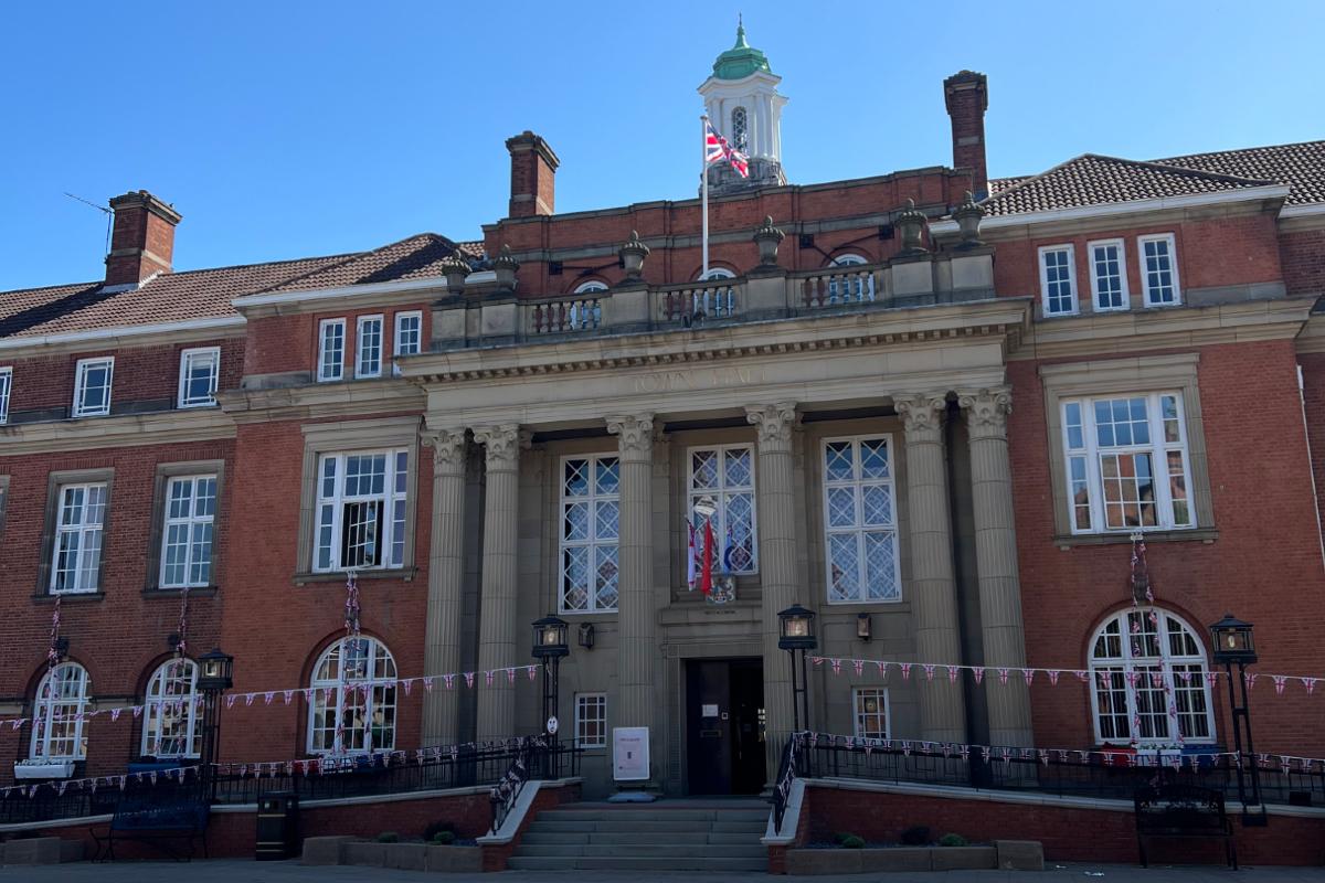 Front of Nuneaton Town Hall with a blue sky