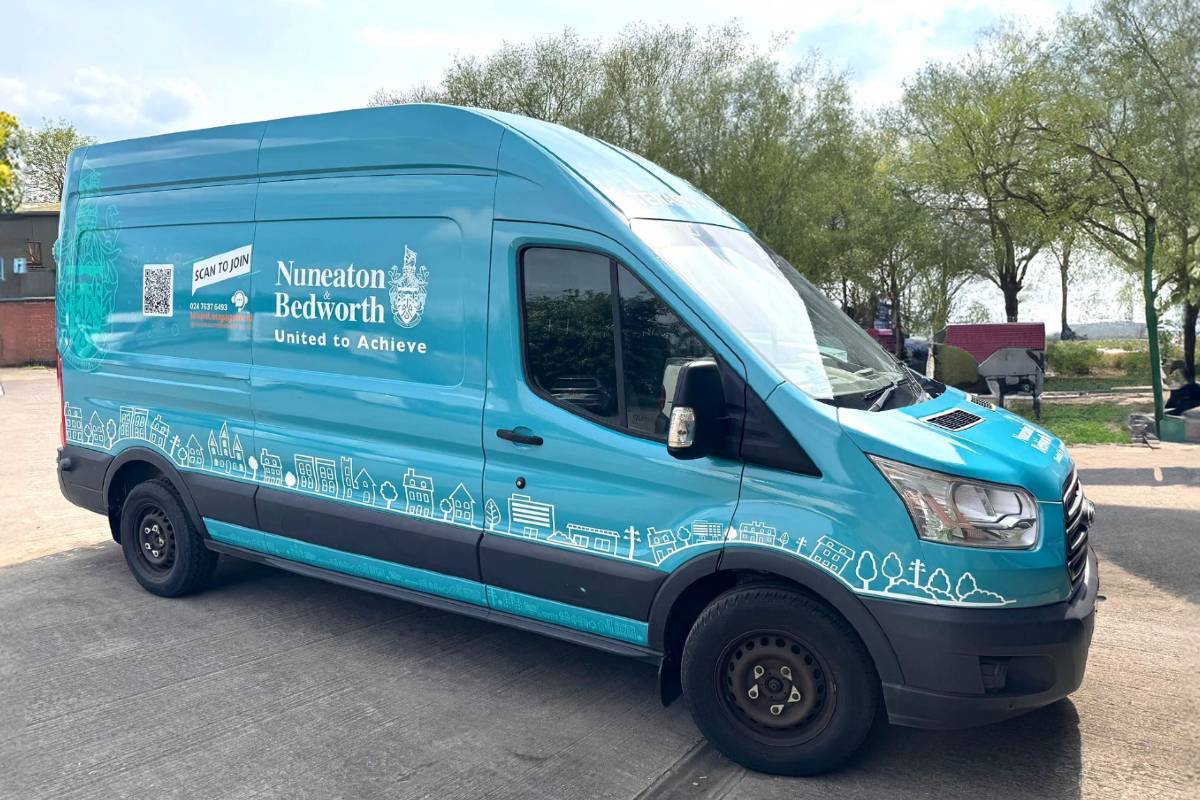 Blue commercial van parked in a car park